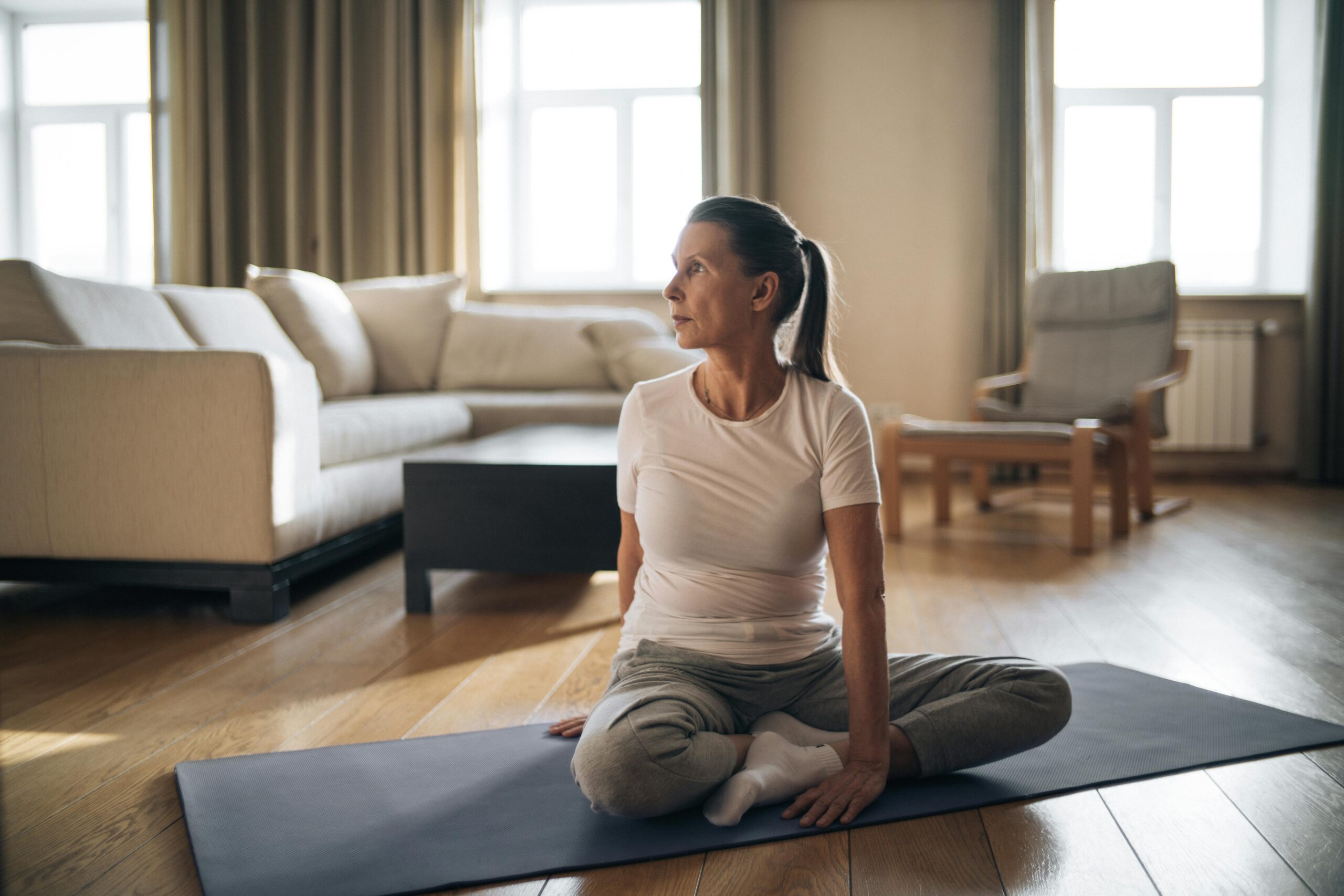 a lady stretching her back prior to exercise
